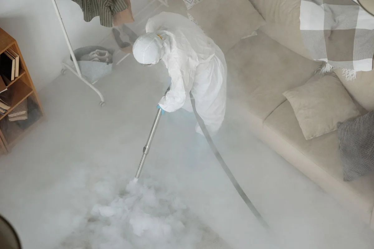 Biohazard cleanup technician in protective equipment, Berry College, GA
